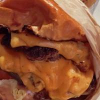 Smash Burger · 8 oz double patty, brioche bun, housemade sauce, fries. Cheese, bacon jam, or bacon for an a...
