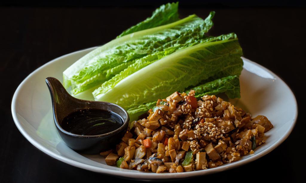 Lettuce Wrap · Romaine lettuce with carrots, green bell peppers, mushrooms, radish, ginger, garlic, water chestnuts, sesame seeds and hoisin sauce. 
Gluten-free option available.