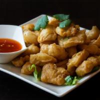 Salt & Pepper  · Deep-fried with scallions, jalapeños, white pepper and five spice, served with a sweet and s...