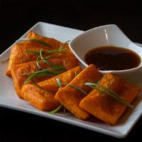 Yellow Tofu · House-made yellow bean tofu is a unique Burmese treat. Silky soft center with a slightly cri...