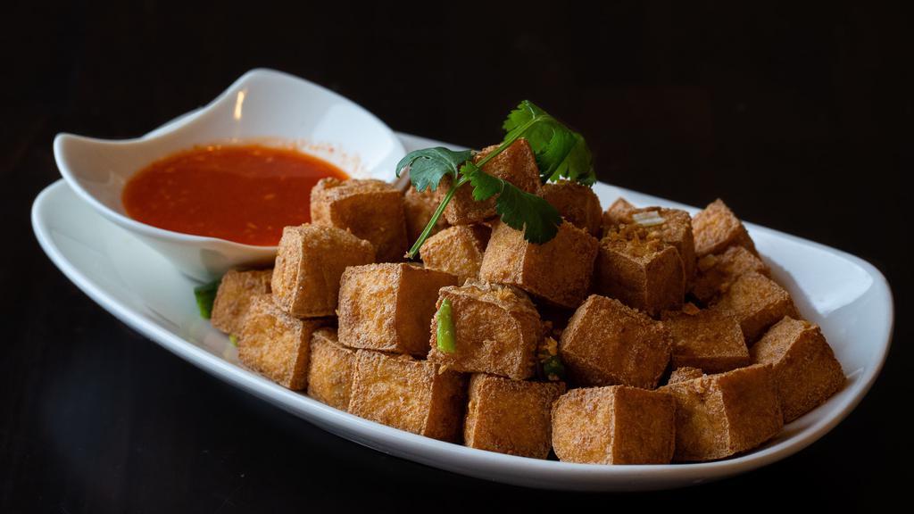 Fried Tofu · Deep-fried soft tofu served with a sweet and sour chili sauce. Gluten-free.