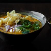  Ohn-No Khao Swe · Coconut chicken curry noodle soup. A rich and creamy bisque with flour noodles and fried won...