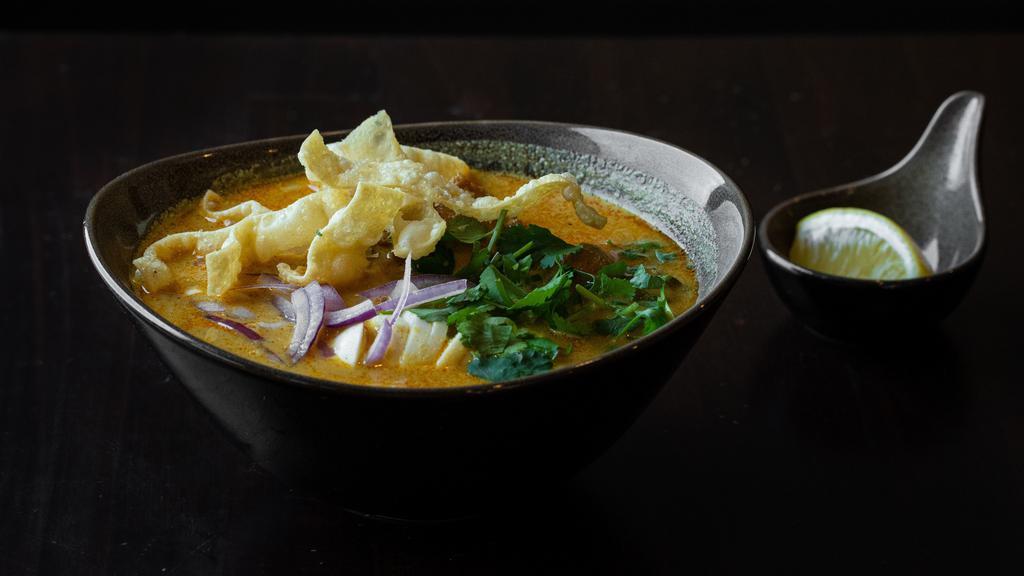  Ohn-No Khao Swe · Coconut chicken curry noodle soup. A rich and creamy bisque with flour noodles and fried won ton. Served with chicken, onions, turmeric powder, and paprika, garnished with onions, cilantro, and fried wonton lemon. Vegetarian option available. Gluten-free option available.
