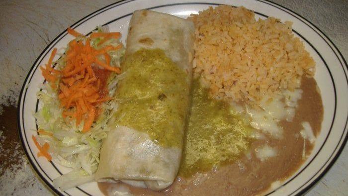 Super Burrito · One super burrito with a choice of ground beef, shredded chicken, chile Verde, chorizo, or carne asada, filled with beans, rice, cheese, salsa, lettuce, guacamole & sour cream. Wet extra for an additional charge.
