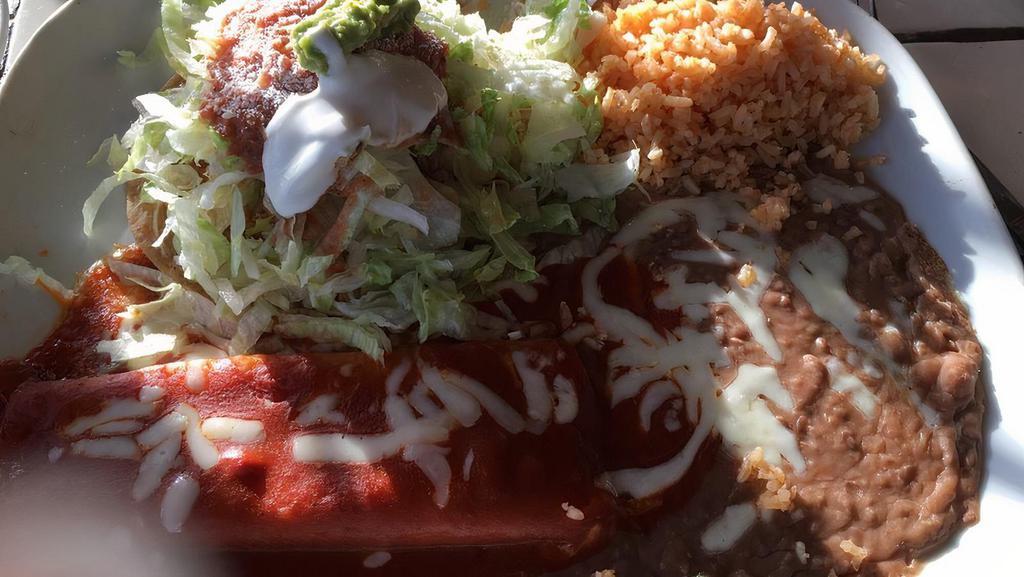 1. Combination Plate · Red sauce chicken enchilada, ground beef taco, and chile relleno.