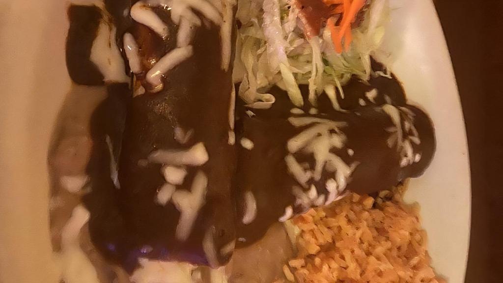 9. Enchiladas de Mole · Rolled enchiladas covered in mole sauce.  Your choice of chicken or cheese.