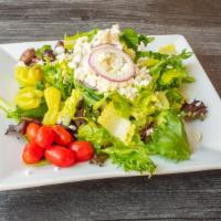Greek Salad · Mixed greens, crisp romaine, cucumber, tomato, garbanzo, red onion, kalamata olives, peppero...