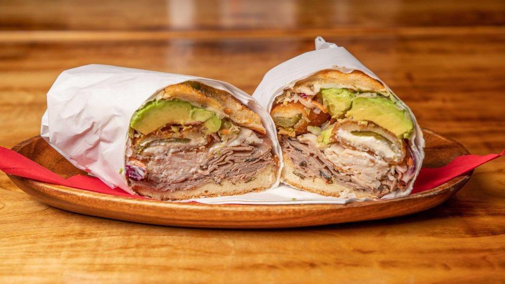 15. King Kong · Roast beef, turkey, ham, imported provolone, jalapeños poppers, avocado, slaw, Godfather and Mob sauce.