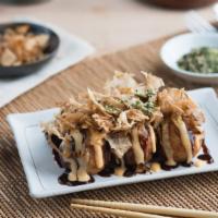 Takoyaki · Ball-shaped Japanese snack filled with diced octopus