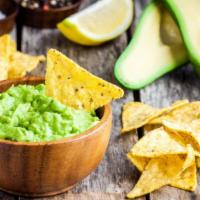 Chips and Guacamole · Bag of tortilla chips with homemade guacamole.