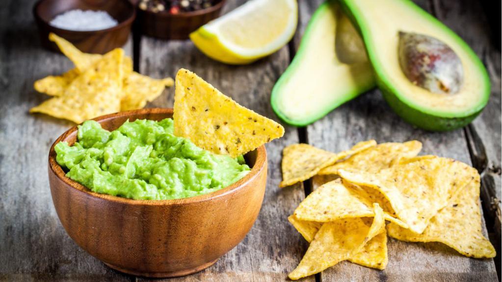 Chips and Guacamole · Bag of tortilla chips with homemade guacamole.