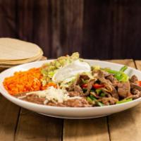 Beef Fajita Plate · Beef steak mixed with bell pepper and onion, rice, beans, cheese, lettuce, tomato and 5 corn...