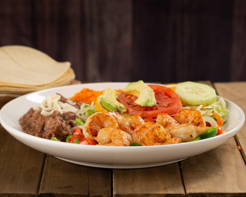 Camarones Rancheros Plate · Mild shrimp mixed with bell peppers and onion, rice, beans, cheese, lettuce, avocado, tomato, orange and 5 corn tortillas.