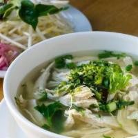 Pho Ga · Poached chicken with rice noodles in ginger-chicken broth. Garnishes of bean sprouts, lime, ...