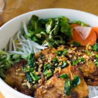 Cha Ca La Vong · Turmeric catfish, dill, fresh herbs, vermicelli noodles, and shrimp-paste sauce.