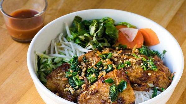 Cha Ca La Vong · Turmeric catfish, dill, fresh herbs, vermicelli noodles, and shrimp-paste sauce.