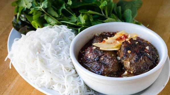 Bun Cha Ha Noi · Grilled pork patties and pork belly, fresh herbs, and vermicelli noodles.