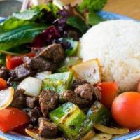 Shaken Beef · Wok-tossed marinated cubed beef, mixed baby greens salad, and salt-pepper-lime, served with ...