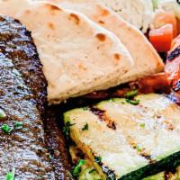Gyros Platter · Mixed beef and lamb, tzatziki, grilled vegetables, horiatiki salad and pita.