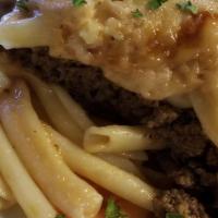 Pastitsio · Layers of macaroni pasta with ground beef in tomato sauce topped with béchamel, bakedand Ser...