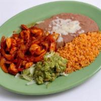 Camarones a la Diabla · Shrimp sautéed with our spicy Diabla sauce and onions, served with guacamole, rice, refried ...