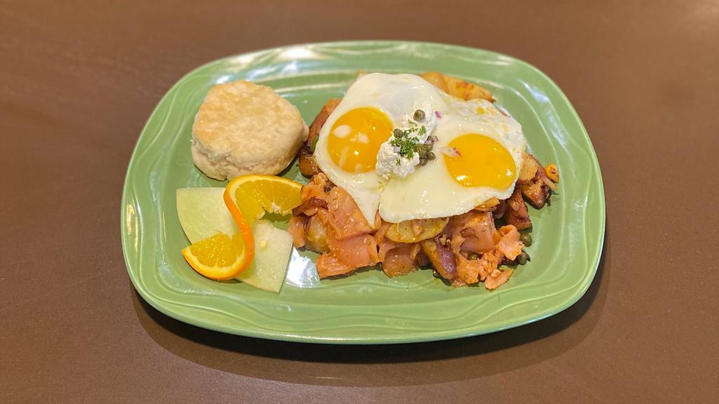 Monterey Hash · Hash house potatoes, smoked salmon, scallions, topped with cream cheese, dill, capers, red onion.