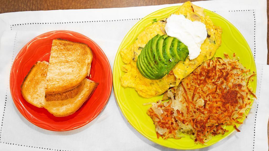 Campbell Omelette · Portabello mushrooms, jalapenos, Cheddar and Jack cheese and green onion topped with avocado.