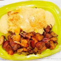 Fried Chicken Benedict · Biscuit, fried chicken, scrambled eggs, bacon all topped with Cheddar cheese and hollandaise...
