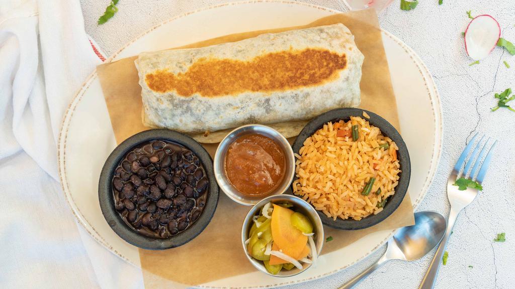 Burrito · Flour tortilla, refried pinto beans, Spansih rice, onions, cilantro, avocado, served with jalapeno escabeche and salsa tatemada. Served with refried pinto beans and Spanish rice on the side.