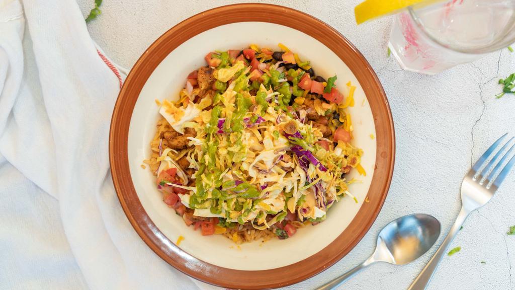 Bowl · Spanish rice, stewed black beans, avocado salsa, pico de gallo, cabbage salad, fried onions and cheddar cheese