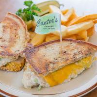 Tuna Melt Sandwich · White tuna with cheddar cheese on grilled rye. Served with a pickle.