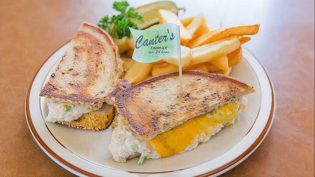 Tuna Melt Sandwich · White tuna with cheddar cheese on grilled rye. Served with a pickle.