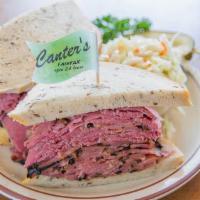 Hot Corned Beef Sandwich · Served on grilled rye bread with a pickle. Choice of side and choice of bread.