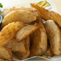 Potato Wedges · One pound of wedged potatoes covered in our special seasoned breading.