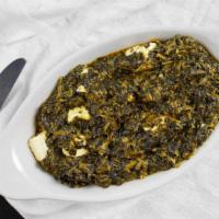 Palak Paneer · Spinach mixed with fresh curd cheese cubes.