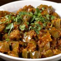 Bhindi · Okra cooked with ginger, garlic, tomatoes, onions and spices.