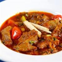 Achar Lamb · In tomato base sauce with slightly tangy blend of spices.