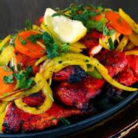 Fish Tandoori · Marinated fish (with garlic, herbs and spices) cooked in clay oven.