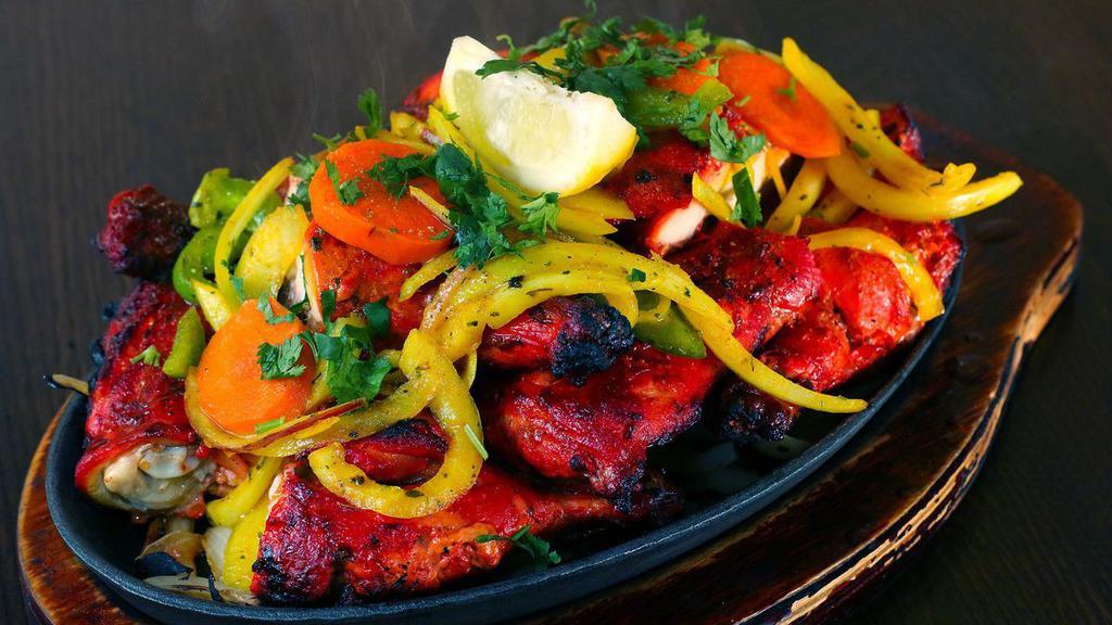 Tandoori Prawns · Marinated prawns (with garlic, herbs and spices) cooked in clay oven.