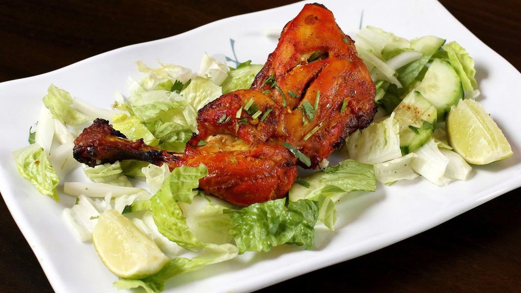Chicken Leg Tandoori · Two pieces. Marinated chicken leg cooked in a clay oven.