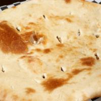 Plain Naan · Indian bread baked in clay oven.