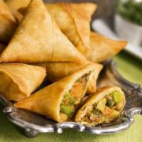 Chicken Samosa · Authentic savory Indian pastry filled with well seasoned chicken.
