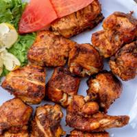 Chicken Boti · Boneless chicken breast marinated in a blend of vinegar and spices, and gently barbequed on ...