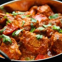 Karahi Chicken · A popular street dish of diced chicken cooked with spices, herbs and tomatoes in traditional...