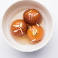 Gulab Jamun · Soft delicious balls made with milk solids soaked in rose flavored sugar syrup.