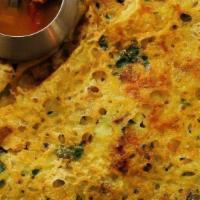 Onion Masala Dosa · Thin crispy rice and lentil crepe filled with potatoes and onions.