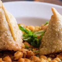 Samosa Tarkari · Vegan. Fried pastry stuffed with mildly spiced potatoes, green peas, and cumin. Served with ...