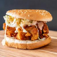Chicken Burger · Fried chicken burger with thinly  chopped cabbage dressed in thousand island sauce.