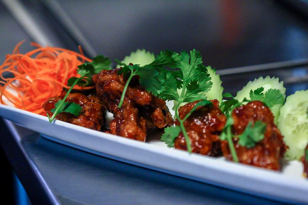 Spicy Chicken Wing 2 U · Medium spicy only! Crispy chicken wing with garlic, ginger, cilantro, cucumber and homemade spicy sauce.
