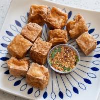 Fried Tofu · Vegetarian. Deep-fried tofu served with chopped peanuts, cilantro and dried chili in sweet a...